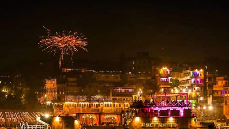 Ganga Aarti ceremony with priests holding fire lamps at Dashashwamedh Ghat